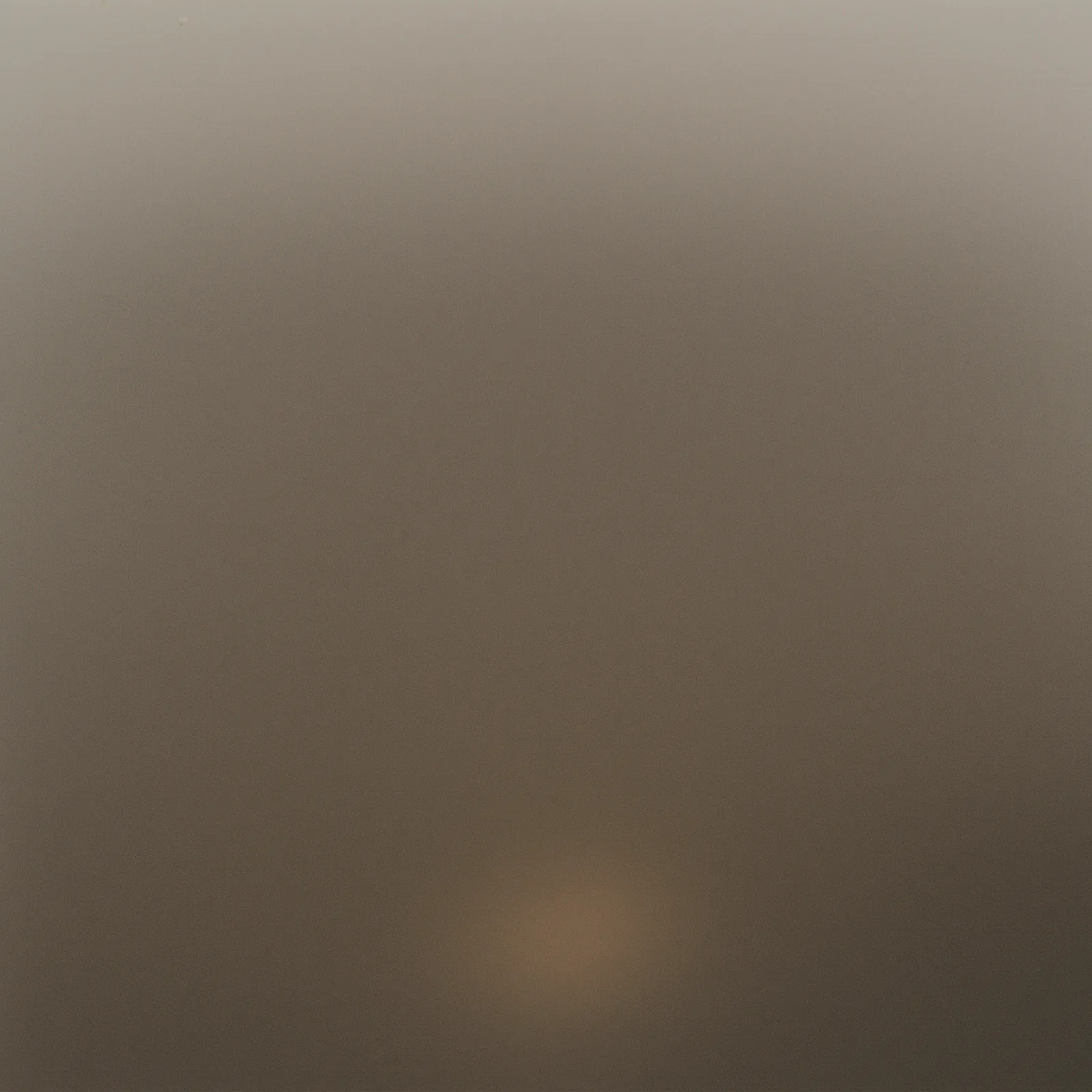 One warm circle of light in an otherwise dark, quiet room